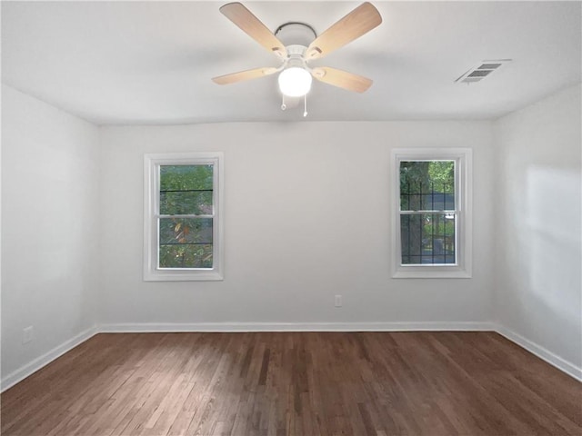 2122 Belhaven Ln SE, Atlanta, GA 30315 - empty room featuring baseboards, ceiling fan, wood finished floors, and visible vents