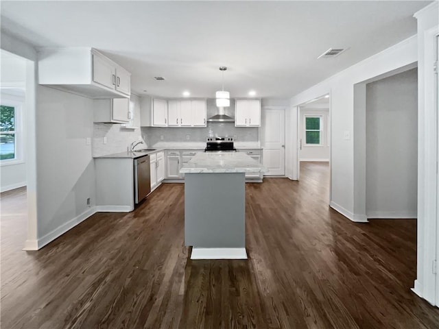 2122 Belhaven Ln SE, Atlanta, GA 30315 - kitchen with a center island, baseboards, white cabinetry, wall chimney range hood, and stainless steel appliances