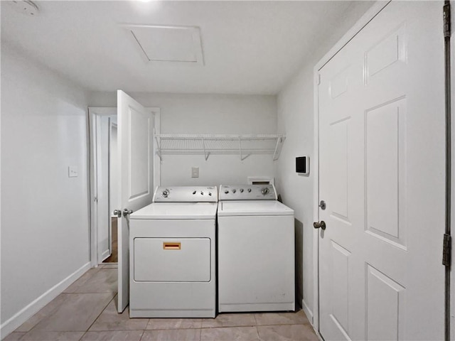 2122 Belhaven Ln SE, Atlanta, GA 30315 - laundry room with laundry area, attic access, washer and dryer, light tile patterned floors, and baseboards
