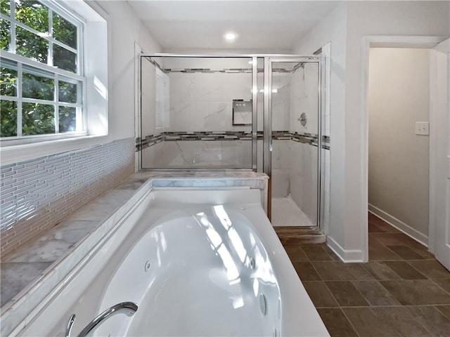 2122 Belhaven Ln SE, Atlanta, GA 30315 - full bath featuring a jetted tub, decorative backsplash, tile patterned flooring, and a shower stall