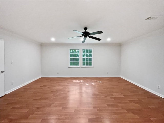 2122 Belhaven Ln SE, Atlanta, GA 30315 - empty room featuring baseboards, ceiling fan, wood finished floors, and visible vents