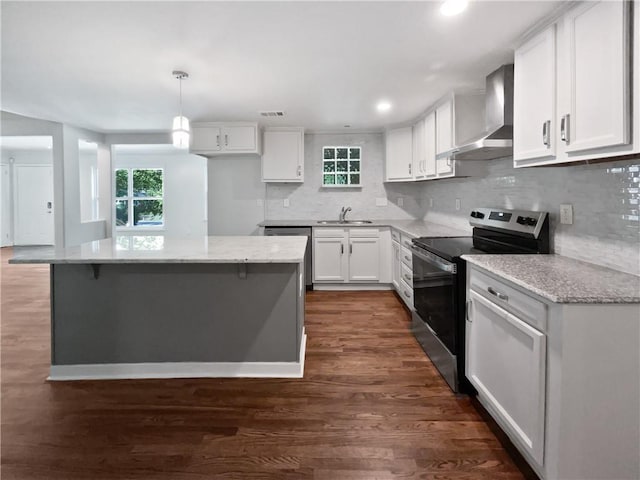 2122 Belhaven Ln SE, Atlanta, GA 30315 - kitchen featuring stainless steel appliances, a healthy amount of sunlight, white cabinetry, wall chimney range hood, and dark wood-style floors