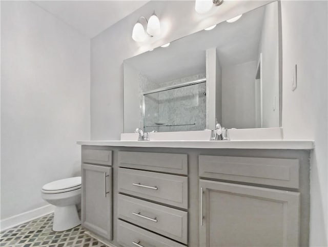 bathroom featuring vanity, toilet, and walk in shower