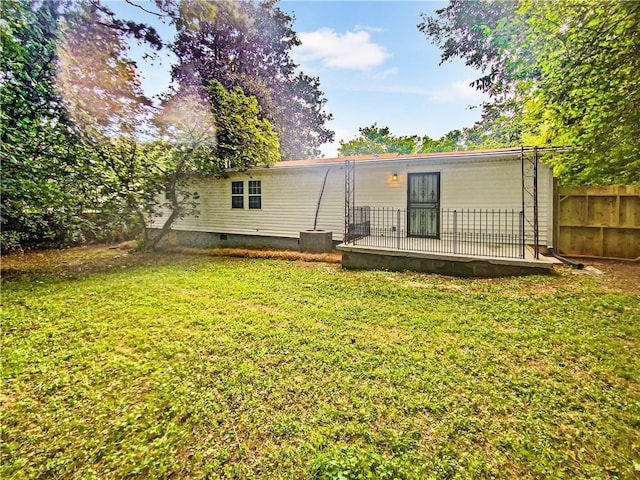 back of property featuring a yard and central air condition unit