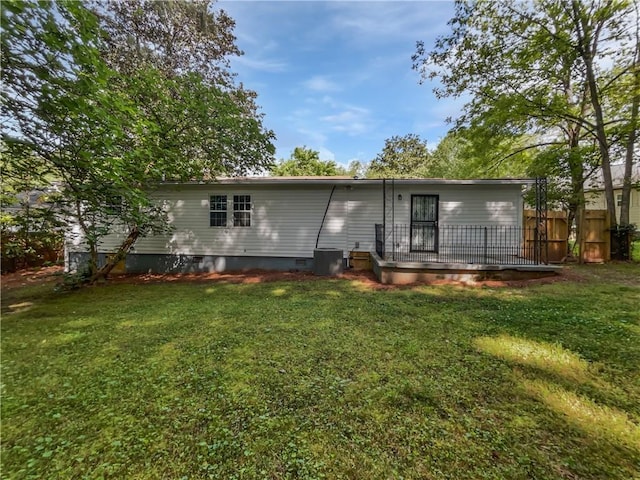 2122 Belhaven Ln SE, Atlanta, GA 30315 - rear view of property with a lawn, fence, central AC, and crawl space