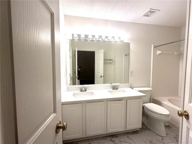 full bathroom with vanity, shower / bathing tub combination, toilet, and a textured ceiling