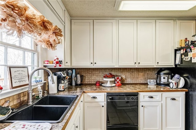 kitchen featuring fridge, white cabinets, backsplash, dishwasher, and sink