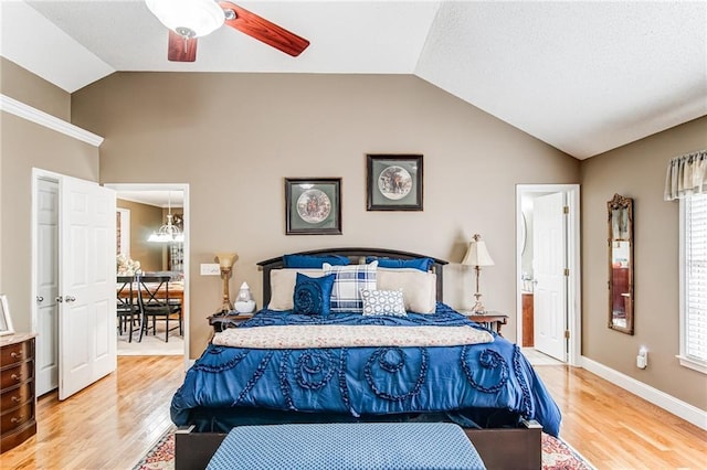 bedroom with lofted ceiling, light hardwood / wood-style floors, and ceiling fan