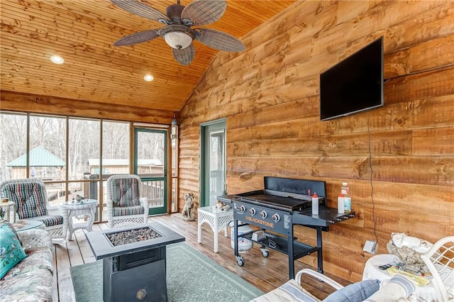 living room with wooden ceiling, ceiling fan, light wood-type flooring, and rustic walls