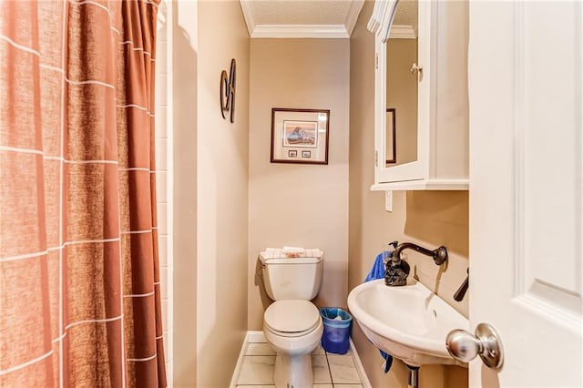 bathroom with toilet, sink, ornamental molding, tile flooring, and a textured ceiling