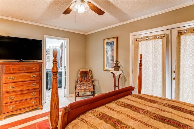 bedroom with ceiling fan, crown molding, ensuite bathroom, light tile flooring, and a textured ceiling