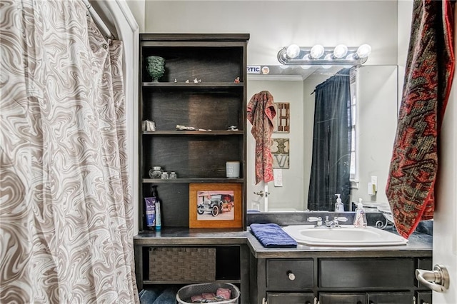 bathroom with vanity and ornamental molding