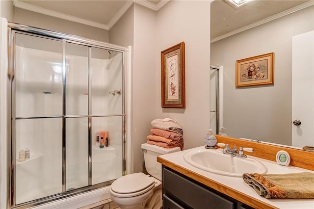 bathroom featuring ornamental molding, toilet, large vanity, and an enclosed shower