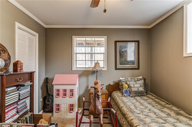 bedroom with light carpet, ornamental molding, a textured ceiling, and ceiling fan