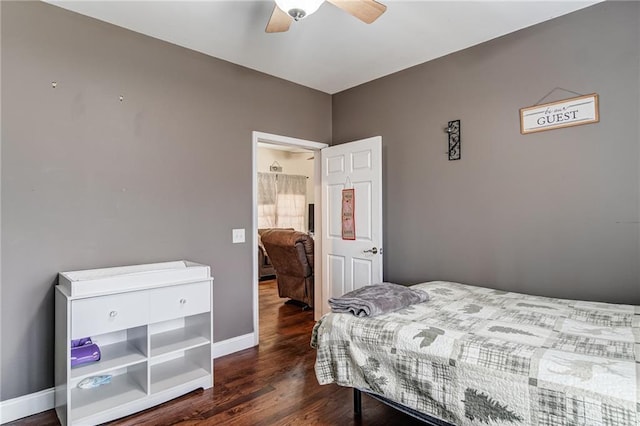 bedroom with dark hardwood / wood-style floors and ceiling fan