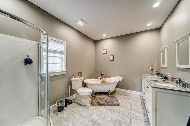 bathroom featuring a bath, tile flooring, toilet, and dual bowl vanity