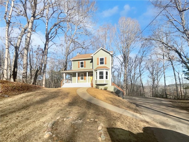 view of front of property featuring covered porch