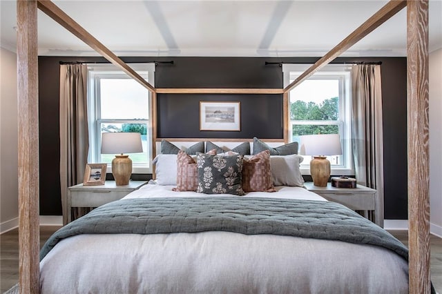 bedroom with wood-type flooring