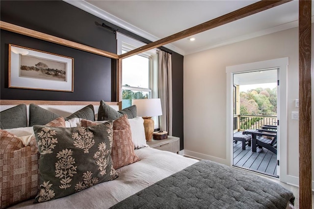 bedroom with ornamental molding, multiple windows, and access to outside