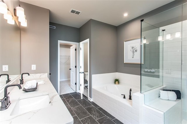 bathroom with separate shower and tub and vanity