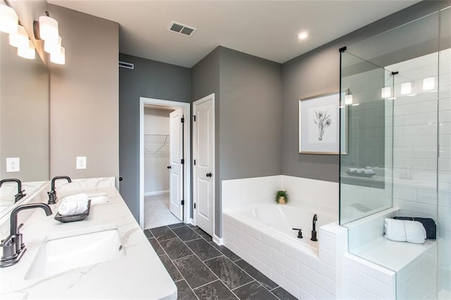 bathroom with independent shower and bath and vanity