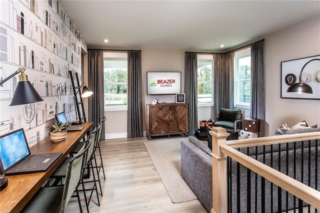 home office featuring light hardwood / wood-style flooring and a wealth of natural light