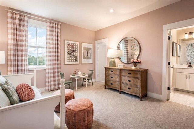 sitting room featuring light colored carpet and sink