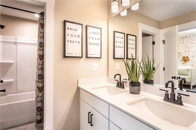 bathroom featuring vanity and shower / bath combination with curtain