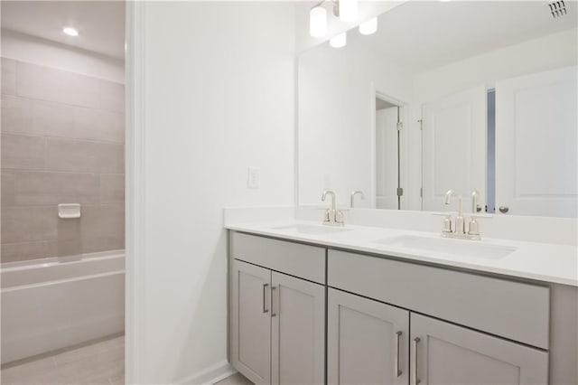 bathroom with shower / bathing tub combination and vanity