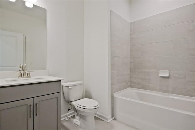 full bathroom featuring toilet, vanity, and tiled shower / bath