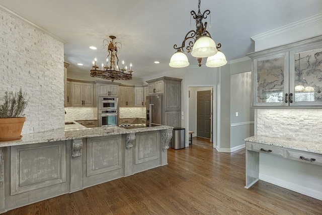 kitchen with pendant lighting, a breakfast bar area, decorative backsplash, ornamental molding, and stainless steel appliances