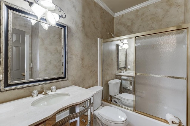 full bathroom with ornamental molding, sink, toilet, and bath / shower combo with glass door