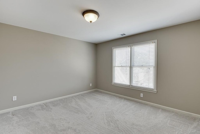 spare room with light carpet