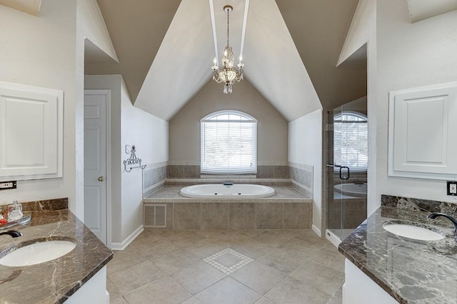 bathroom featuring lofted ceiling, vanity, tile patterned flooring, and a chandelier