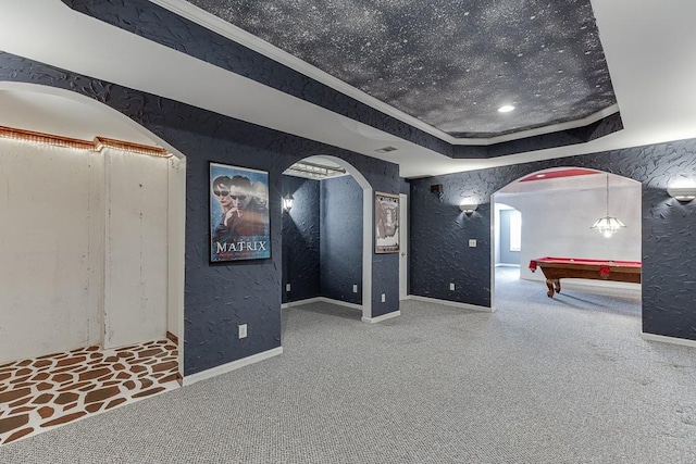 home theater with crown molding, billiards, and a tray ceiling