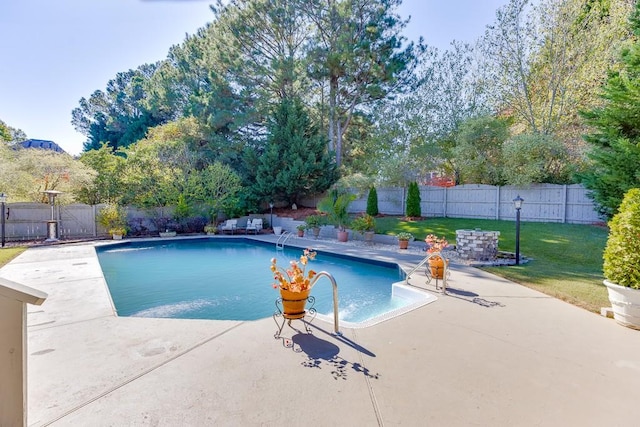 view of pool with a yard and a patio