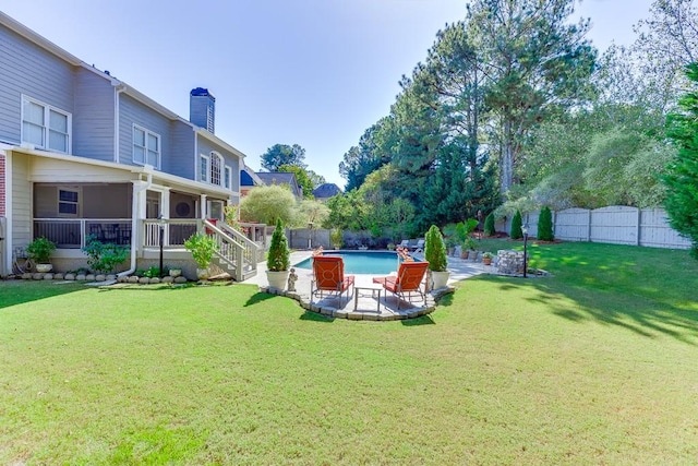 view of yard featuring a fenced in pool and a patio