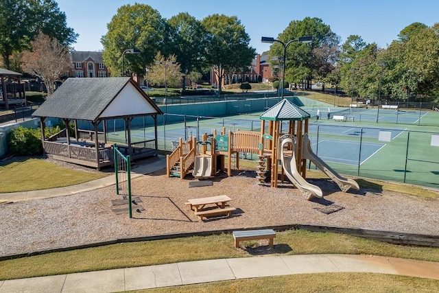 view of playground featuring tennis court