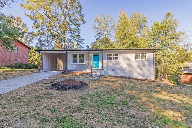 ranch-style home with a carport