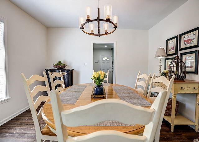 dining area featuring an inviting chandelier and wood finished floors