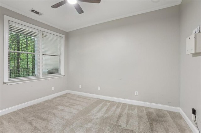 1215 Comet View Trl SE, Smyrna, GA 30082 - unfurnished room featuring crown molding, ceiling fan, light colored carpet, and visible vents