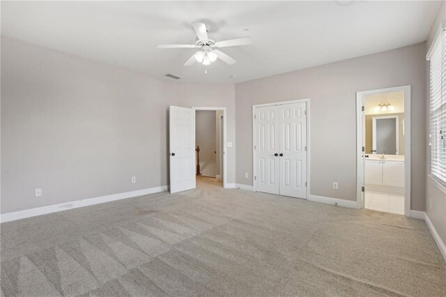 1215 Comet View Trl SE, Smyrna, GA 30082 - unfurnished bedroom with light carpet, ensuite bath, baseboards, visible vents, and a closet
