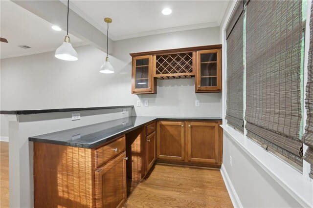 1215 Comet View Trl SE, Smyrna, GA 30082 - bar with indoor wet bar, ornamental molding, light wood finished floors, and decorative light fixtures