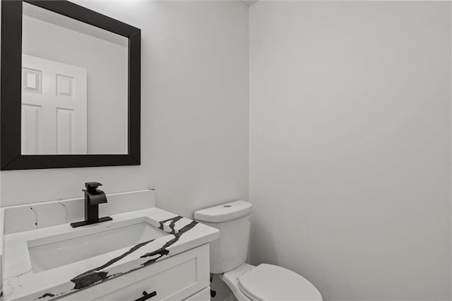 1069 Alford Rd, Lithonia, GA 30058 - half bath featuring vanity and toilet