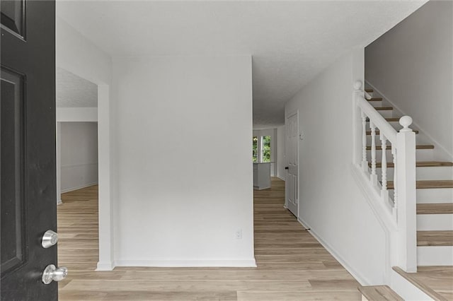 1069 Alford Rd, Lithonia, GA 30058 - entryway featuring light wood-type flooring and stairway