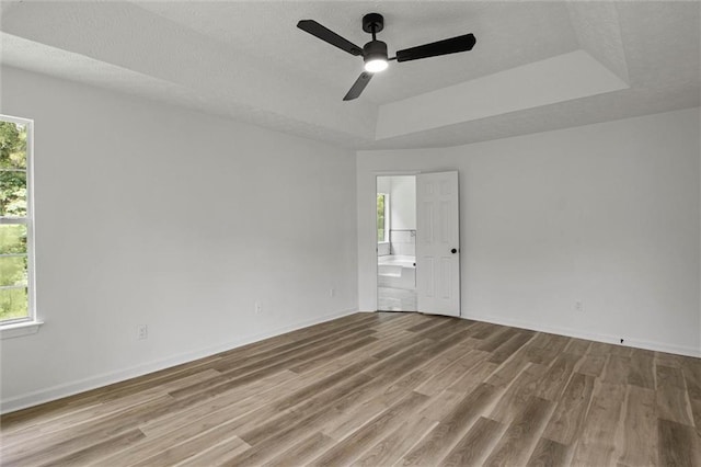 1069 Alford Rd, Lithonia, GA 30058 - unfurnished room featuring a raised ceiling, wood finished floors, and a ceiling fan