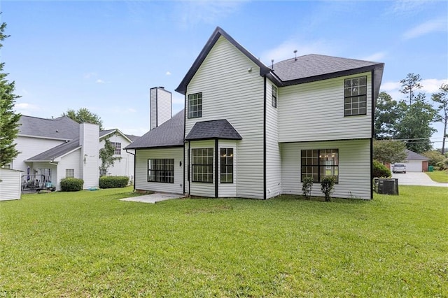 1069 Alford Rd, Lithonia, GA 30058 - back of house featuring a lawn, a chimney, and roof with shingles