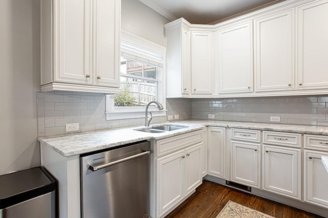 kitchen with decorative backsplash, dark wood-type flooring, white cabinets, a sink, and dishwasher