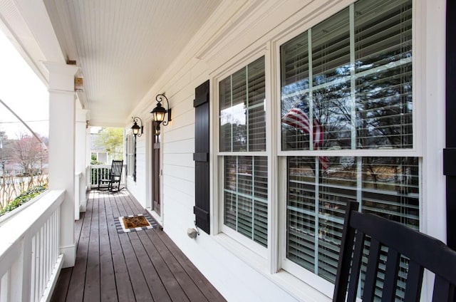 wooden deck featuring covered porch