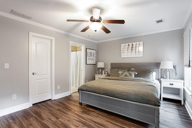 bedroom featuring wood finished floors, visible vents, and crown molding